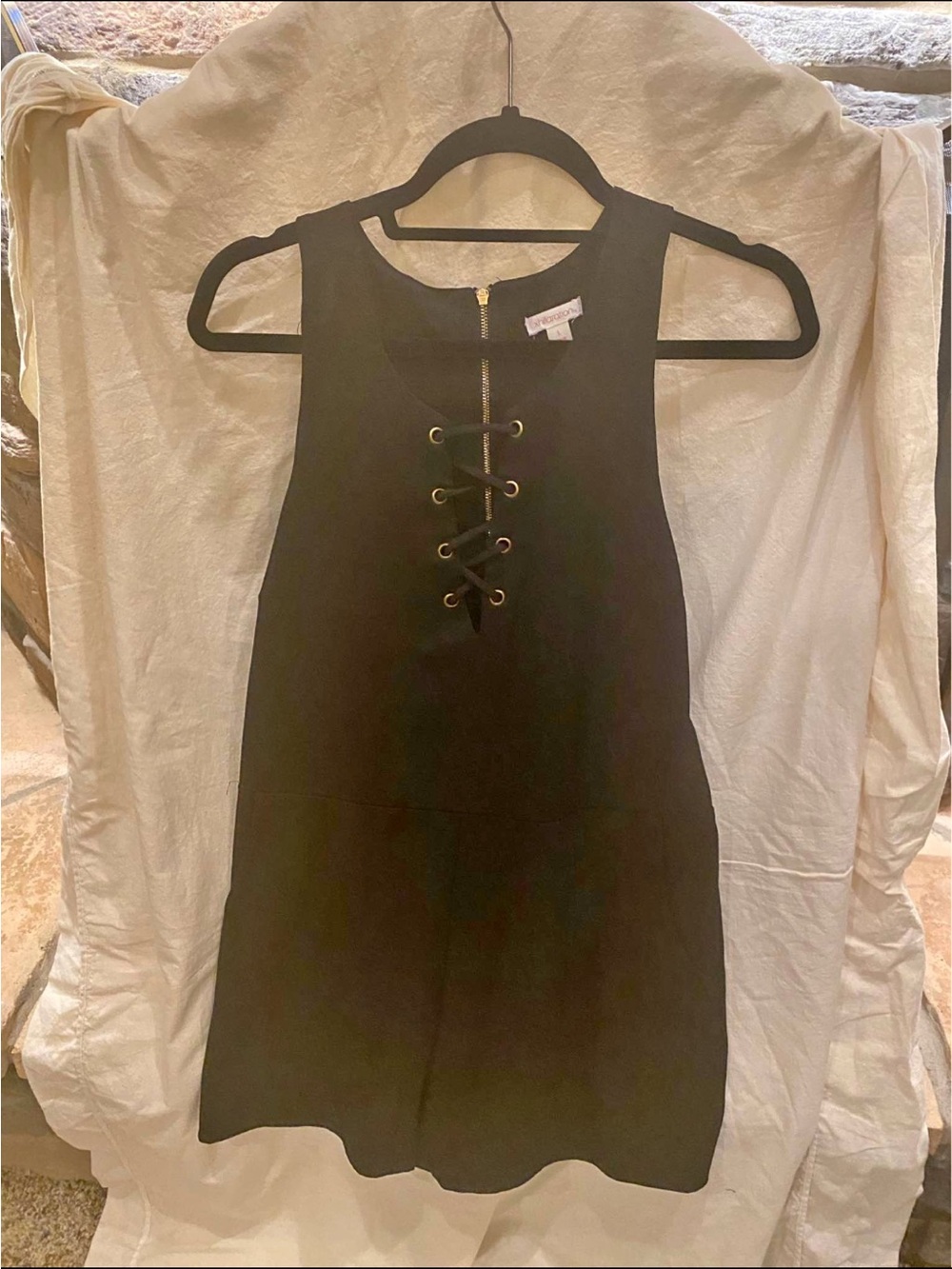 Xhilaration sleeveless romper with a lace-up front